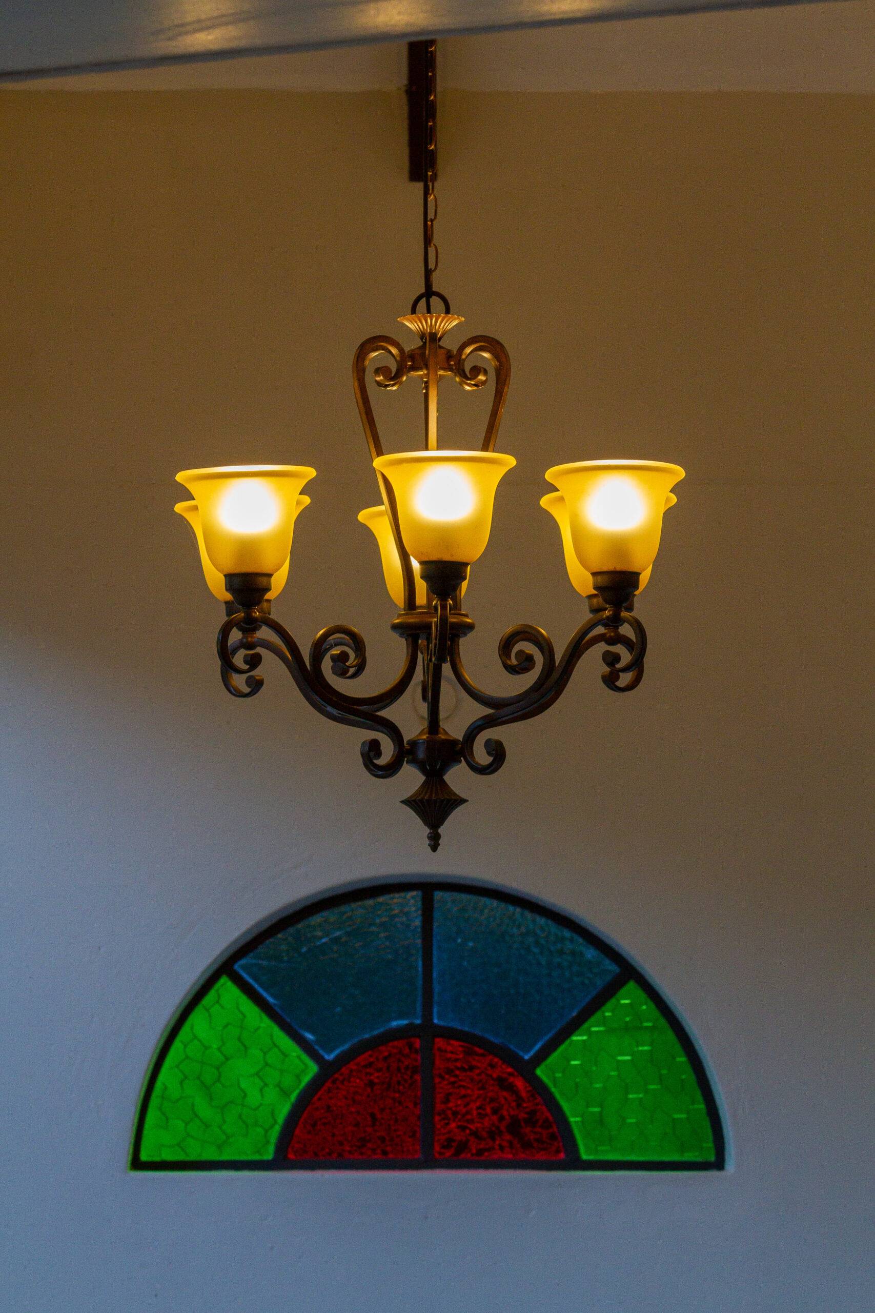 Chandelier and Stained glass window at The Courtney Lodge