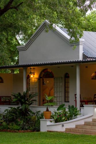 The verandah in evening light at The Courtney Lodge, Victoria Falls