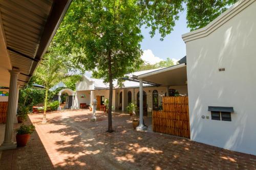 The courtyard at The Courtney Lodge, Victoria Falls