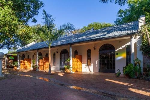 The courtyard showing room entrances and private seating areas at The Courtney Lodge, Victoria Falls