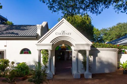 Entrance to the courtyard at The Courtney Lodge, Victoria Falls
